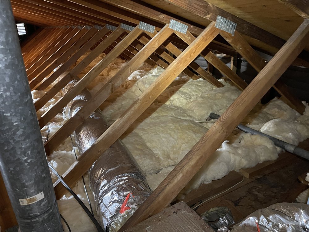 Attic framing and ductwork prepared for air sealing